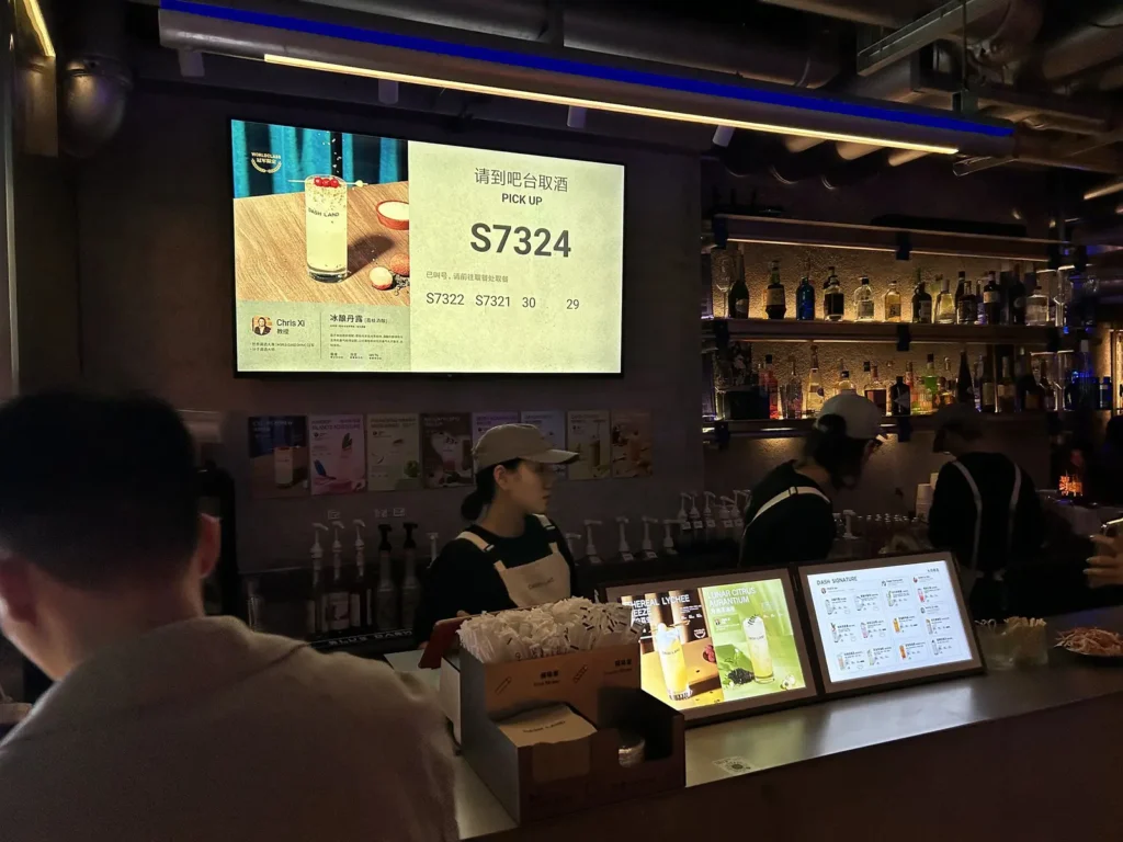 A display shows when your cocktail is ready to collect at Dashland, a budget cocktail bar in Shanghai