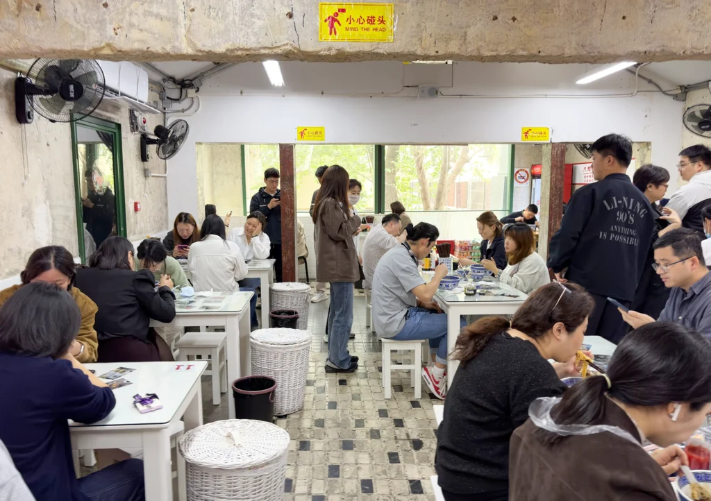 Customers at Huxi Old Alley Noodles in Shanghai
