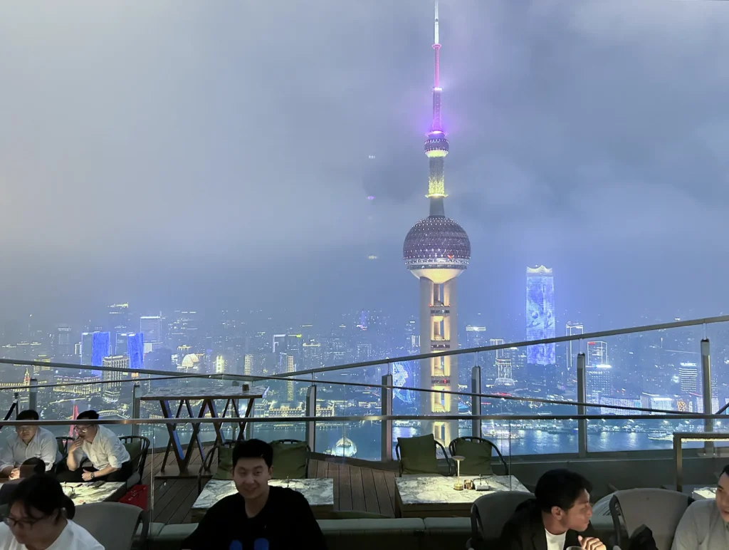 View from Flair rooftop bar at the Ritz-Carlton Pudong in Shanghai overlooking the Oriental Pearl Tower.