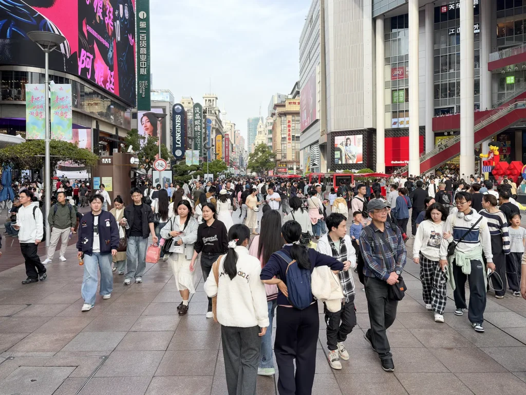 Tourists on the busy pedestrianised section of Nanjing Road East in Shanghai