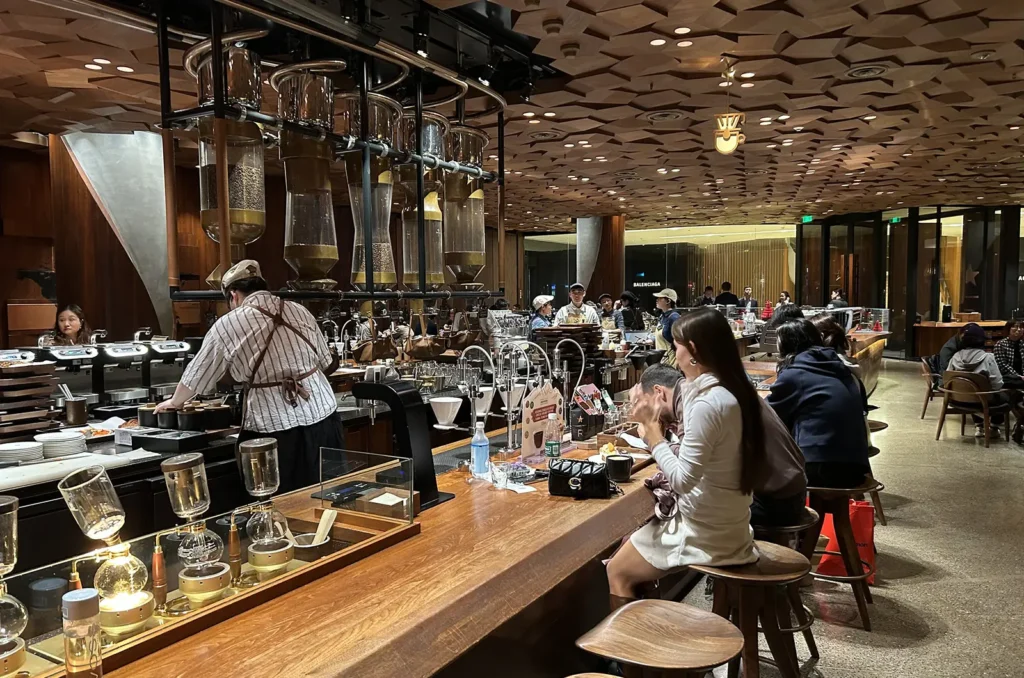 Customers at Starbucks Roastery in Shanghai enjoying coffee at the seated bar