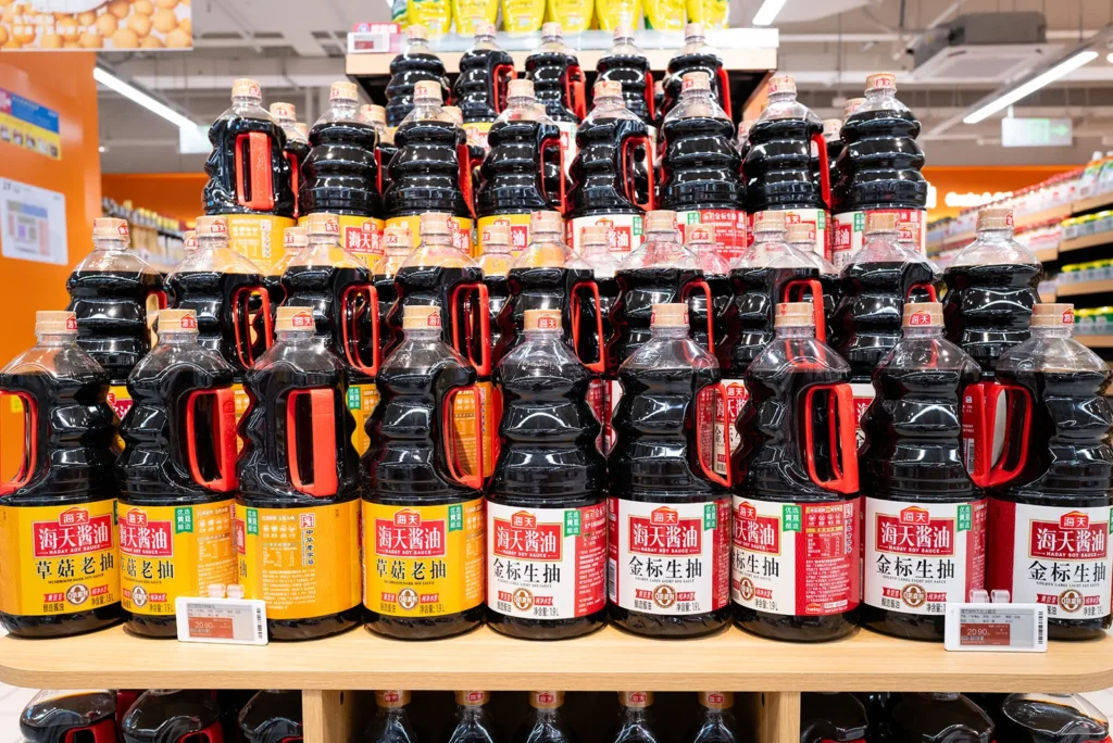 Large selection of soy sauce and Chinese condiments at a Century Mart hypermarket in Shanghai