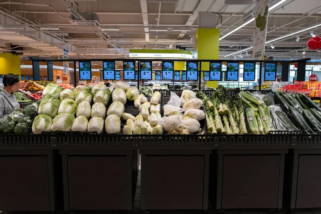 Fresh vegetables and produce section inside a Century Mart hypermarket in Shanghai