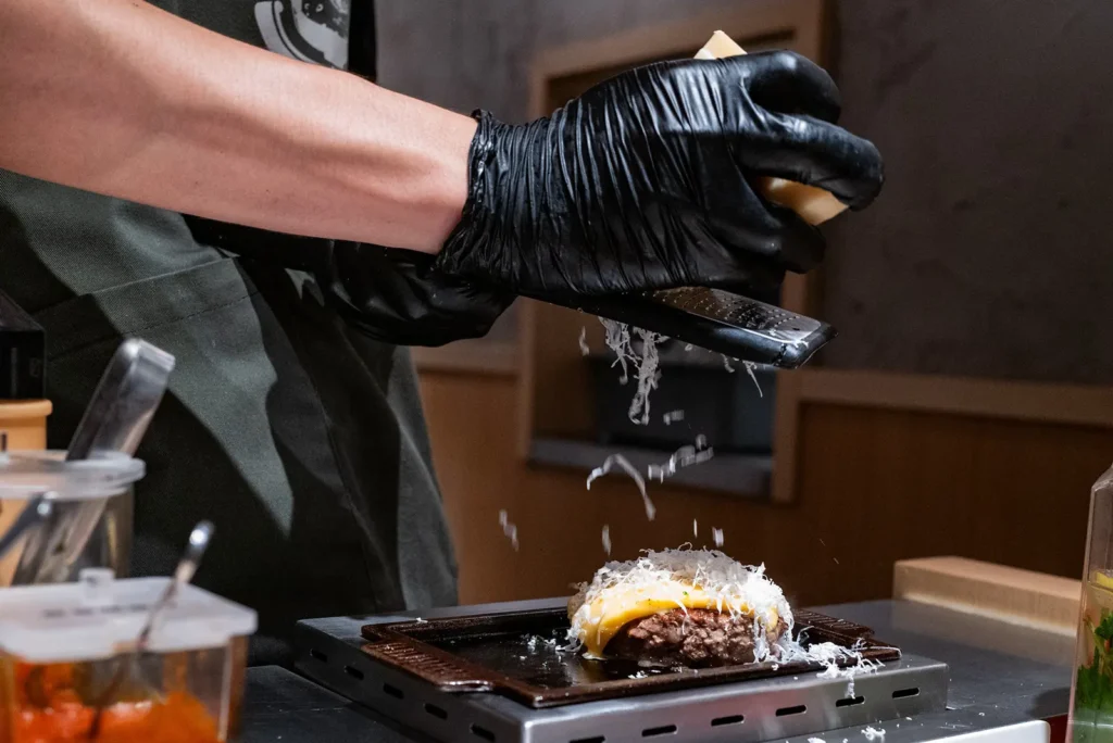 Grated cheese on top of the burger at Niku Niku Oh!! Kome
