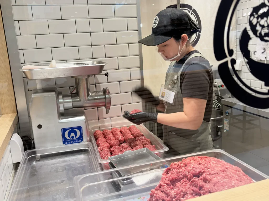 Burgers being prepped from freshly ground beef at Niku Niku Oh!! Kome in Shanghai