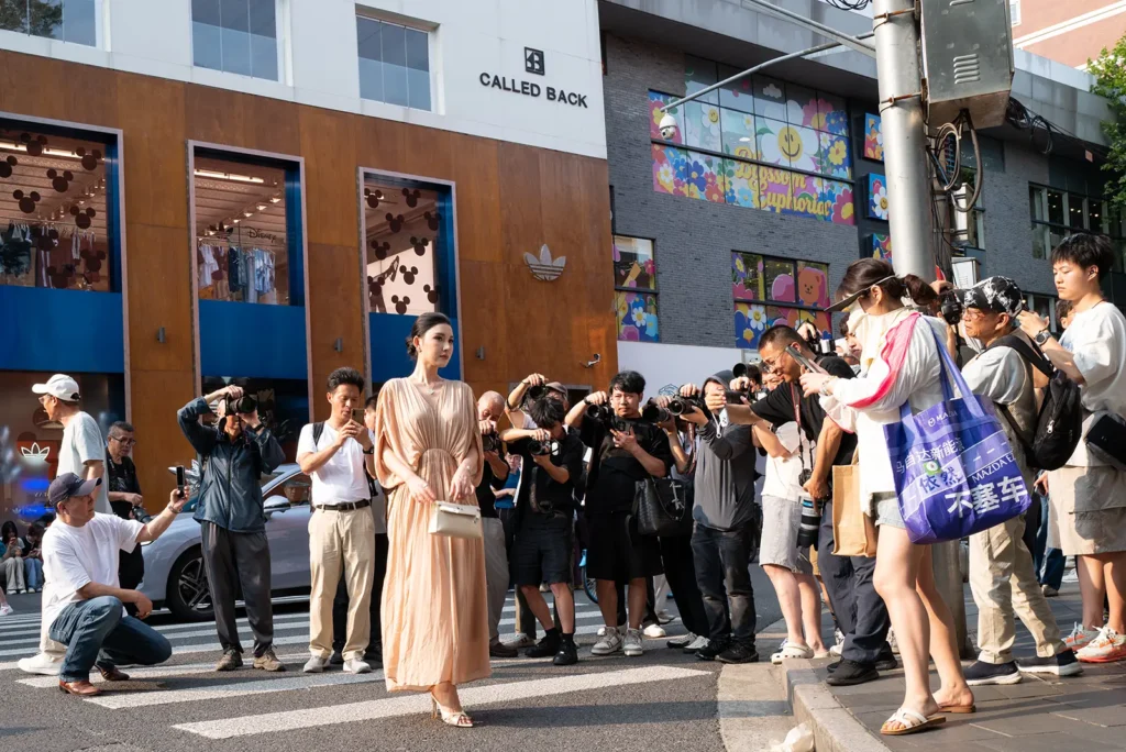 Photographers photographing a fashionable passer-by on Anfu Road in Shanghai